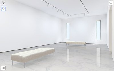 This medium sized gallery has a clean modern décor with a white marble floor. The walls are washed with a combination of spots and natural light from the three windows.